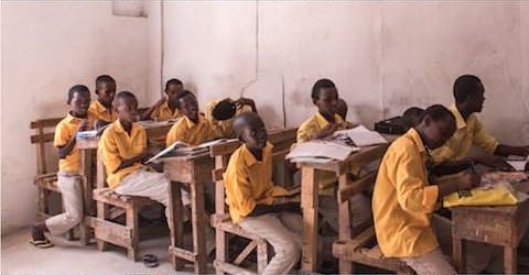Children at their desks in a Muslim Hands school
